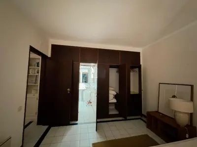 a room with a bathroom with a toilet and a mirror at T2 sobre a praia - Albufeira/Olhos de Água in Albufeira