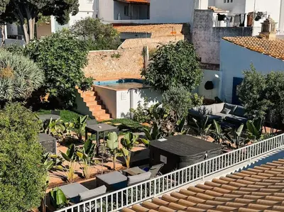 an overhead view of a patio with tables and chairs at Old Fisherman's Corner 16 - Centro Old Town Albufeira in Albufeira