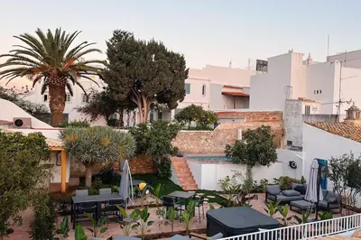 a view of a courtyard with chairs and a pool at Old Fisherman's Corner 16 - Centro Old Town Albufeira in Albufeira