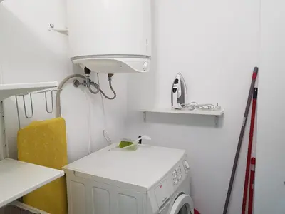 a white laundry room with a washing machine in it at T1 BOAVISTA 6 VISTA MAR Wi-Fi Ar Cond in Quarteira