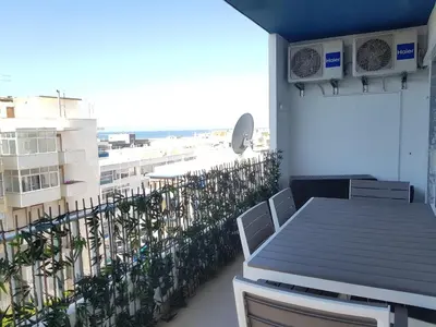 a balcony with a table and a view of the beach at T1 BOAVISTA 6 VISTA MAR Wi-Fi Ar Cond in Quarteira