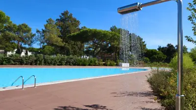 a swimming pool with a water fountain at Villa Emilia - Clever Details , Central Vilamoura, Sleeps 6, luxury, walking distance in Vilamoura