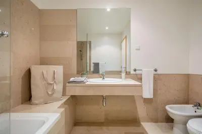 an apartment complex with a garden and buildings at Appartement Luxueux dans un site Exceptionnelle Vilamoura in Vilamoura