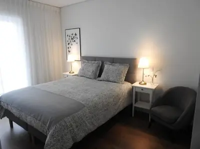 a living room with a couch and a table at Black&light in Faro in Faro