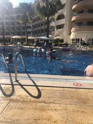 a group of people in a swimming pool at a hotel at Semanas 30 e 24 Vila Galé Cerro Alagoa in Albufeira