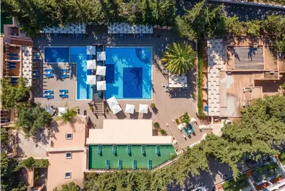 a patio with a table and chairs on a balcony at Balaia Beach by MTPhomes in Albufeira