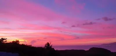 a sunset with a pink and purple sky at Appartement Standing au coeur d'Albufeira in Albufeira