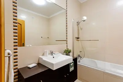 a bathroom with a sink and a shower at São João das Areias By Albufeira Rental in Albufeira