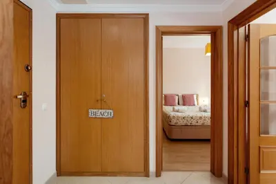 a door with a keep sign on it in a bedroom at São João das Areias By Albufeira Rental in Albufeira