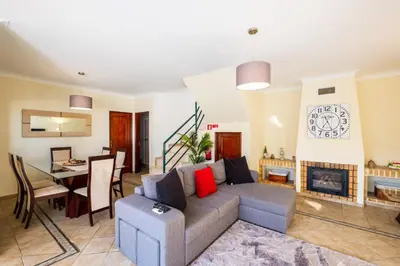 a living room with a couch and a table at Villa Sequeira - Private Pool - Free WIFI - BY BEDZY in Albufeira