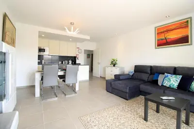 a living room with a couch and a table at Albufeira Prestige With Pool by Homing in Albufeira