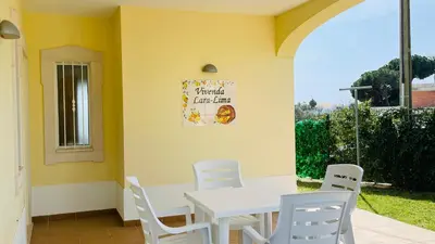 a dining room with a white table and white chairs at Lara Lima by Check-in Portugal in Albufeira