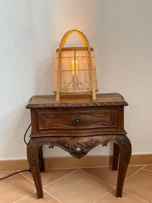 a wooden table with a bird cage on top of it at Santa Clara Old Town in Albufeira