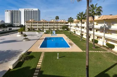 an overhead view of the courtyard of a building with a swimming pool at Vila Atlântida - Vilamoura-Quarteira Holiday Home - Beach at 250 mts in Quarteira