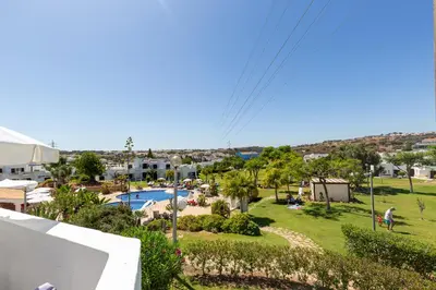 a view from the balcony of a resort with a swimming pool at Amazing 2-Bedroom Appartment with big terrace! in Albufeira