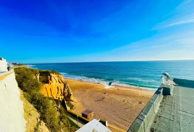 a view of a beach and the ocean at Ocean View Apartment Hakuna Matata in Albufeira