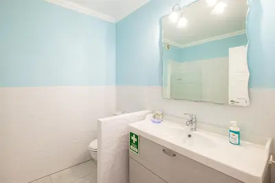 a pool at a resort with blue chairs at #082 Families Only - São Rafael by Home Holidays in Albufeira