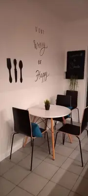 a dining room with a table and chairs at OmniaX Apartment in Faro