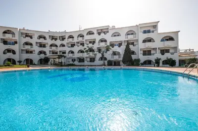 a picture of a beach with a sunset at #081 T1 Vale Mangude 312 by Home Holidays in Albufeira