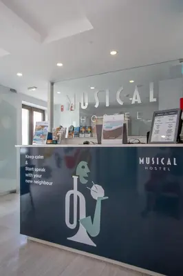 a sign for a museum with a woman holding a book at Musical Hostel in Albufeira
