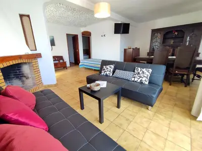 a living room with a couch and a table at Apartamento V2 Pedro - By Bedzy in Albufeira