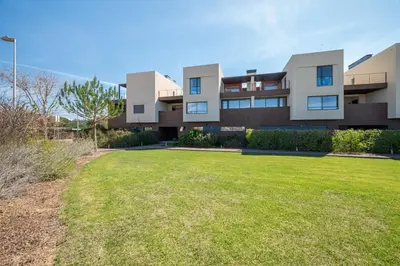 an exterior view of a house with a yard at Apart L'Orange in Vilamoura