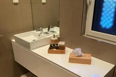 a bathroom counter with a sink and a mirror at Villa Cascata, 3 bedroom, Pool, close to Olhos de Agua in Albufeira