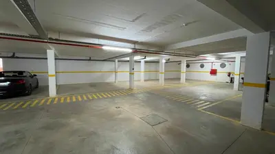 an empty parking garage with a car parked in it at Villa Cascata, 3 bedroom, Pool, close to Olhos de Agua in Albufeira