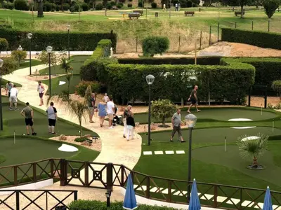 a group of people playing golf in a park at Villa Cascata, 3 bedroom, Pool, close to Olhos de Agua in Albufeira