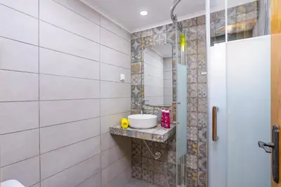 a bathroom with a sink and a mirror at Villa Casa Calma by Villa Plus in Albufeira