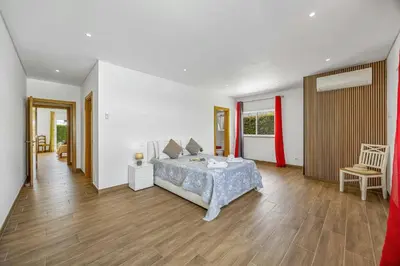 a room with two beds and a window at Villa Quinta dos Abacates by Villa Plus in Olhos de Água