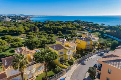 an aerial view of a house and the ocean at Villa Quinta dos Bicos by Villa Plus in Albufeira
