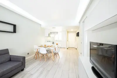 a living room with a couch and a table at Blue Star Luxury Apartment by Atlantic Places in Albufeira
