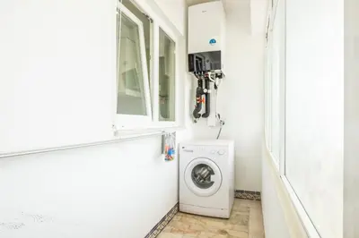 a laundry room with a washer and dryer at Blue Star Luxury Apartment by Atlantic Places in Albufeira