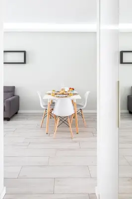 a dining room with a table and chairs at Blue Star Luxury Apartment by Atlantic Places in Albufeira