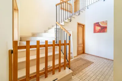 a bedroom with two beds and a window at Villa Galé in Guia
