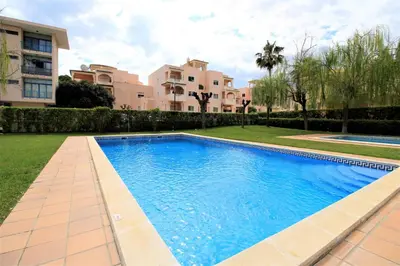 a swimming pool in a yard next to a building at Vilamoura MiraGolf With Pool by Homing in Vilamoura