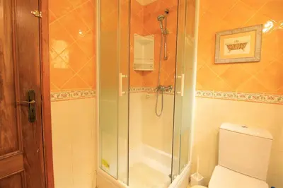 a bathroom with a shower and a toilet at Vilamoura MiraGolf With Pool by Homing in Vilamoura