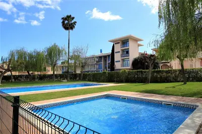 a swimming pool in a yard next to a building at Vilamoura MiraGolf With Pool by Homing in Vilamoura