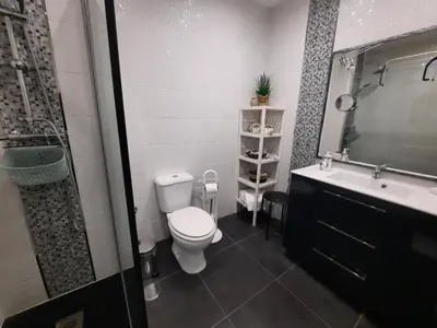 a bathroom with a toilet and a sink at Casa Cerro Sol in Albufeira