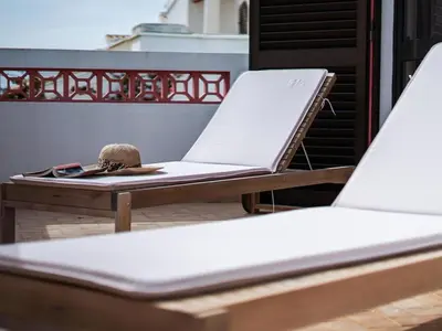 a pair of chairs sitting on top of a table at Villa Bel Mar by Stay ici Algarve Holiday Rental in Guia