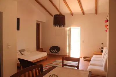 a living room with a bed and a couch at Quinta do Amendoal o melhor da Natureza no Algarve in Terras Novas