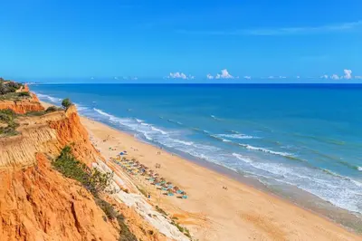 a table with breakfast food on a balcony with a view at Albufeira Premium Charming Stays in Albufeira