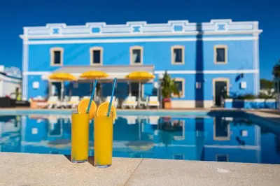 a bathroom with a sink and a tub and a toilet at Albufeira Premium Charming Stays in Albufeira