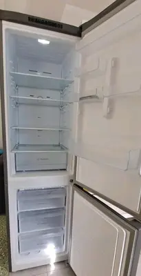 an open refrigerator with its door open and its doorsearchacersacersacers at Guest House Casa Ramos on the Strip in Albufeira
