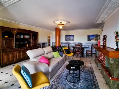 a living room with a couch and a table at FLH Faro Family Flat with Balcony in Faro