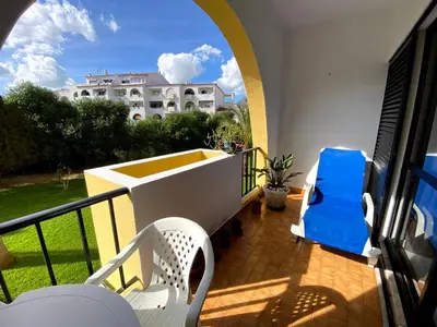 a balcony with chairs and a view of a building at CASA IRINA Centro Cidade Albufeira in Albufeira