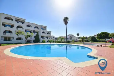 a large swimming pool in front of a building at Vale Mangude A by MTPhomes in Albufeira