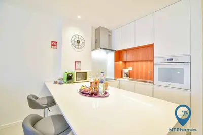 a kitchen with a white counter and a microwave at Vale Mangude A by MTPhomes in Albufeira