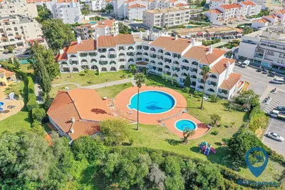 an aerial view of a building with a swimming pool at Vale Mangude A by MTPhomes in Albufeira